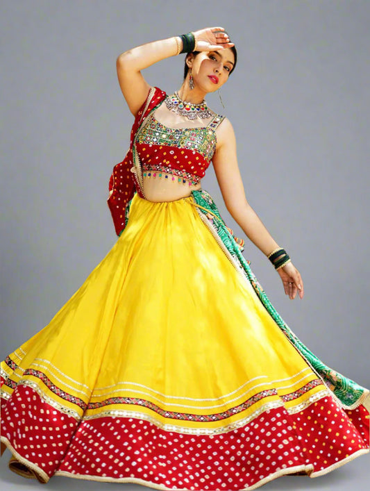 Woman in a colorful traditional outfit with a yellow and red dress in an outdoor setting.