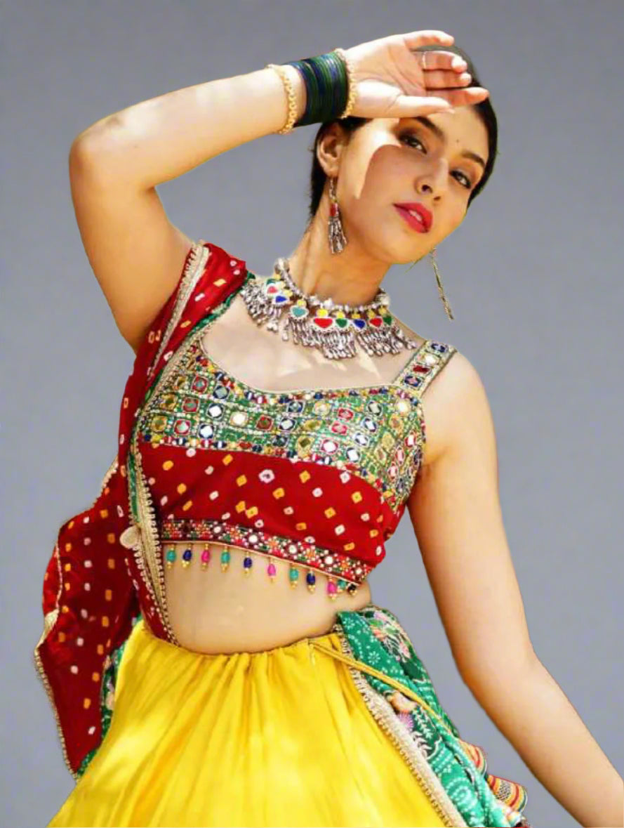 Woman in traditional colorful outfit with jewelry against a natural background